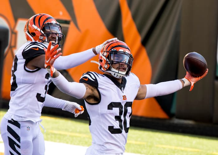 Cincinnati Bengals free safety Jessie Bates (30) celebrates with Cincinnati Bengals cornerback LeShaun Sims (38) after intercepting a pass in the end zone for a touchback in the first quarter of the NFL game between Cincinnati Bengals and Tennessee Titans on Sunday, Nov. 1, 2020, in Cincinnati. Cincinnati Bengals At Tennessee Titans